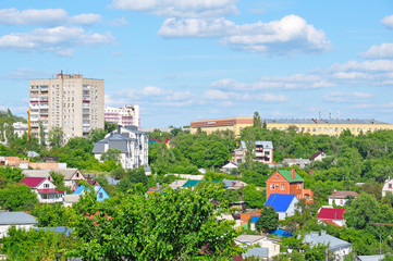Obraz premium City view with private and high-rise buildings in summer