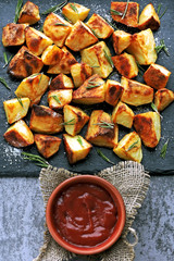 Baked potato served on a stone board. Potatoes in a rustic style