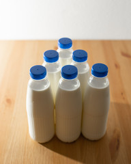 milk bottles on wooden table