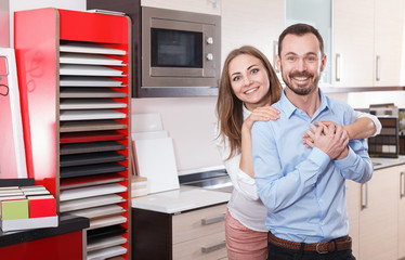 Couple in kitchen furniture store