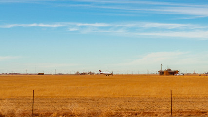 Obraz premium Airplane in Field Airport