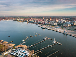 port of rostock - aerial view over the river warnow - background city of rostock
