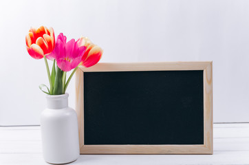 Mother's day concept.Chalkboard with tulips