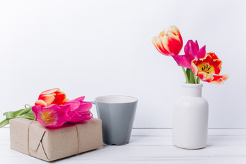 Mother's day composition.Vase with flowers and breakfast.