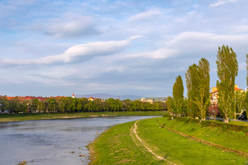 Spring view of Uzh river in Uzhhorod city, Ukraine. Uzh River located in the Transcarpathia region in Ukraine and in Michalovce and Sobrance district in Slovakia. It flows into the Laborec river