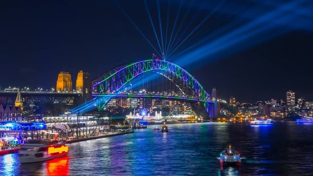 Sydney Harbour Bridge during Vivid Sydney Festival - time lapse video with zoom effect of the Spectacular light show and reflection around the Sydney Harbour Bridge and CBD of Sydney