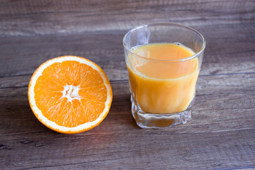 Orange juice, summer cocktail with orange. Orange slice.