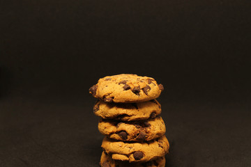 chocolate chip cookies on black background