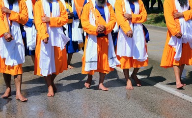 adherents of the Sikh religion during a march on the barefoot