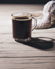Cup of black coffee on table