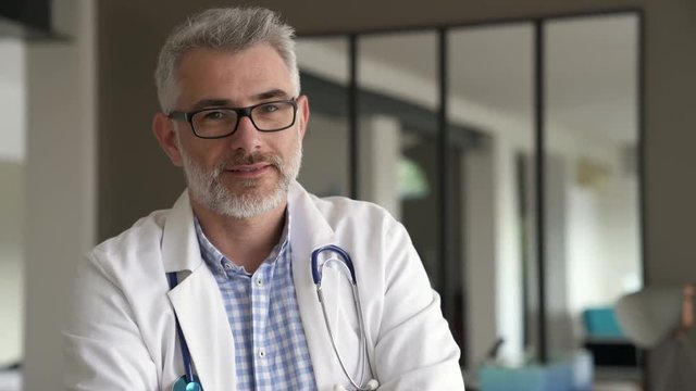 Portrait of confident doctor in private clinic