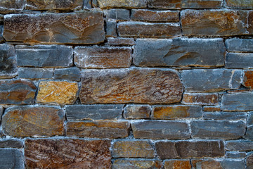 wall of trap rock in grey and brown