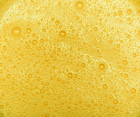 Yellow Mango milkshake with bubbles texture