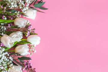 spring flower arrangement on a pink background