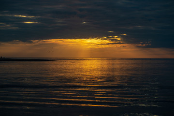 colorful sunset on the sea beach in summer