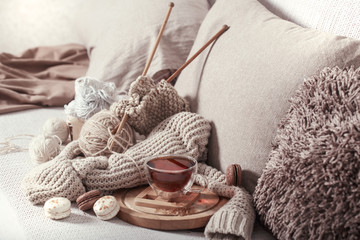 vintage knitting needles and yarn with a Cup of tea