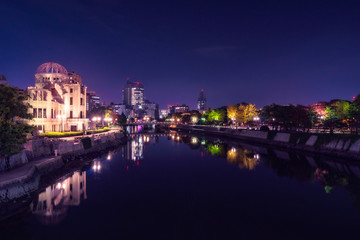 Hiroshima Cityscape by night with the Atomic Bomb Dome on the side of Motoyasu River in Japan.