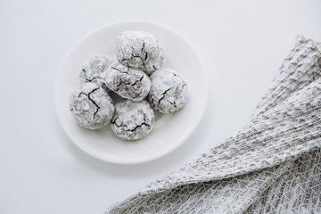 Chocolate amaretti cookies on the white plate