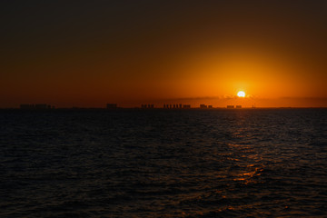 Fototapeta na wymiar Sunset on the Caribbean Sea. Orange shades.