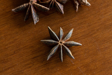 Macro of star anise on wooden table