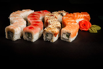 assorted philadelphia sushi rolls with salmon, eel, tuna and tiger shrimp
