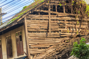 Abandoned houses with damage roof and wall. Grungy wooden house that abandoned and demolished roof...