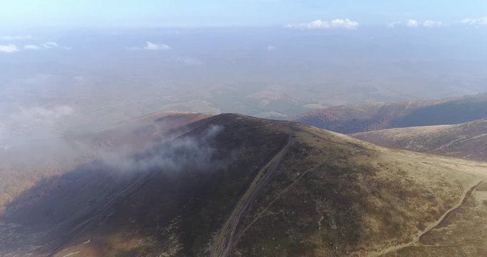 Aerial view: Flying over an amazing mountain near the peak of Gemba. 4k