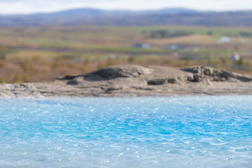 Haukadalur Valley, Iceland with abstract closeup of azure blue Great Geysir Geyser pool landscape with nobody in south Hot Springs geothermal Golden Circle