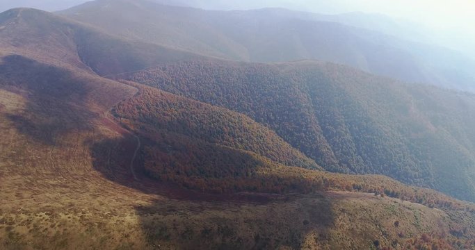 Aerial view: Flying over an amazing autumn mountain near the peak of Gemba. 4k