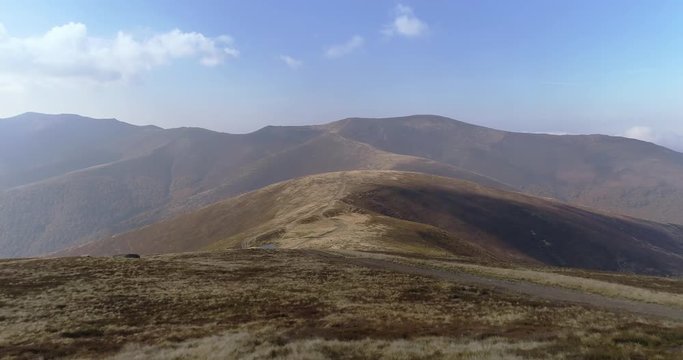 Aerial view: Flying over an amazing mountain near the peak of Gemba. 4k