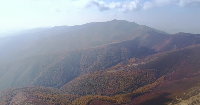 Aerial view: Flying over an amazing autumn mountain near the peak of Gemba. 4k