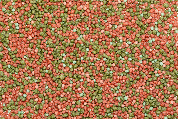 Small fish feed. Background texture.