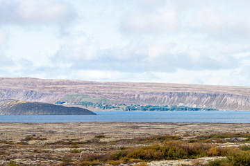 Landscape high angle view of Thingvellir mountains and lake with clouds on golden circle in Iceland during day and blue color water in autumn