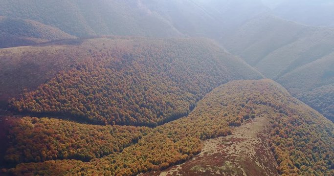 Aerial view: Flying over an amazing autumn mountain near the peak of Gemba. 4k