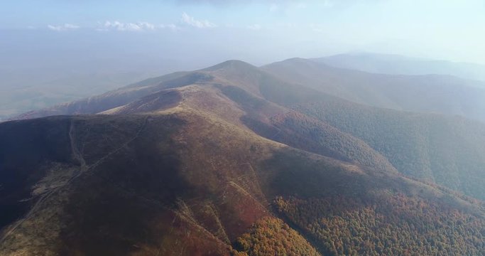 Aerial view: Flying over an amazing mountain near the peak of Gemba. 4k