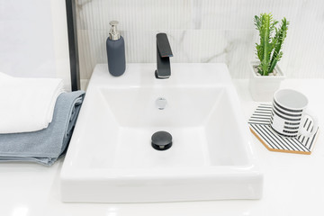 Bathroom interior with sink and faucet.