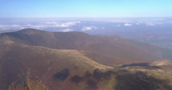 Aerial view: Flying over an amazing mountain near the peak of Gemba. 4k