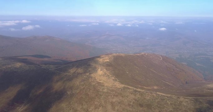 Aerial view: Flying over an amazing mountain near the peak of Gemba. 4k