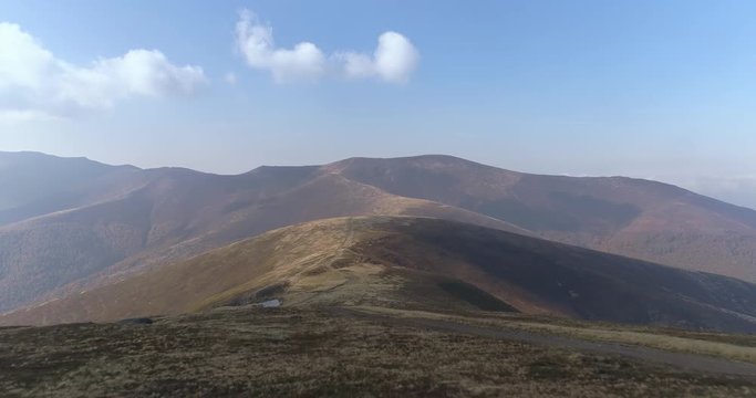 Aerial view: Flying over an amazing mountain near the peak of Gemba. 4k
