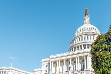 Washington DC, USA US Congress dome construction exterior with steps stairs view and flag on Capital capitol hill with blue sky columns pillars and scaffolding © Andriy Blokhin