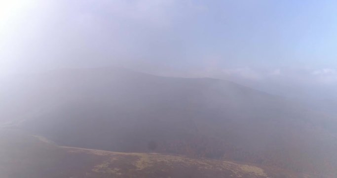 Aerial view: Flying over an amazing mountain near the peak of Gemba. 4k