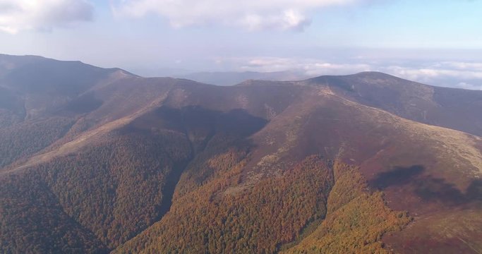 Aerial view: Flying over an amazing mountain near the peak of Gemba. 4k