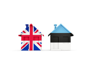 Two houses with flags of United Kingdom and estonia
