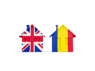 Two houses with flags of United Kingdom and romania