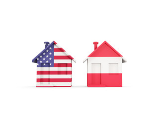 Two houses with flags of United States and austria