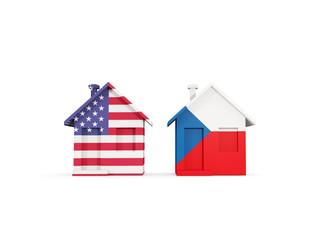 Two houses with flags of United States and czech republic