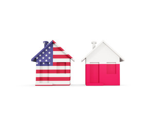 Two houses with flags of United States and poland