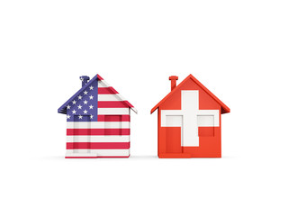 Two houses with flags of United States and switzerland