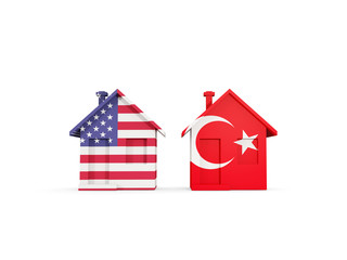 Two houses with flags of United States and turkey
