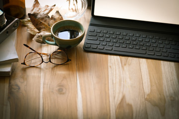 Wooden rustic loft  desk with tablet computer and copy space